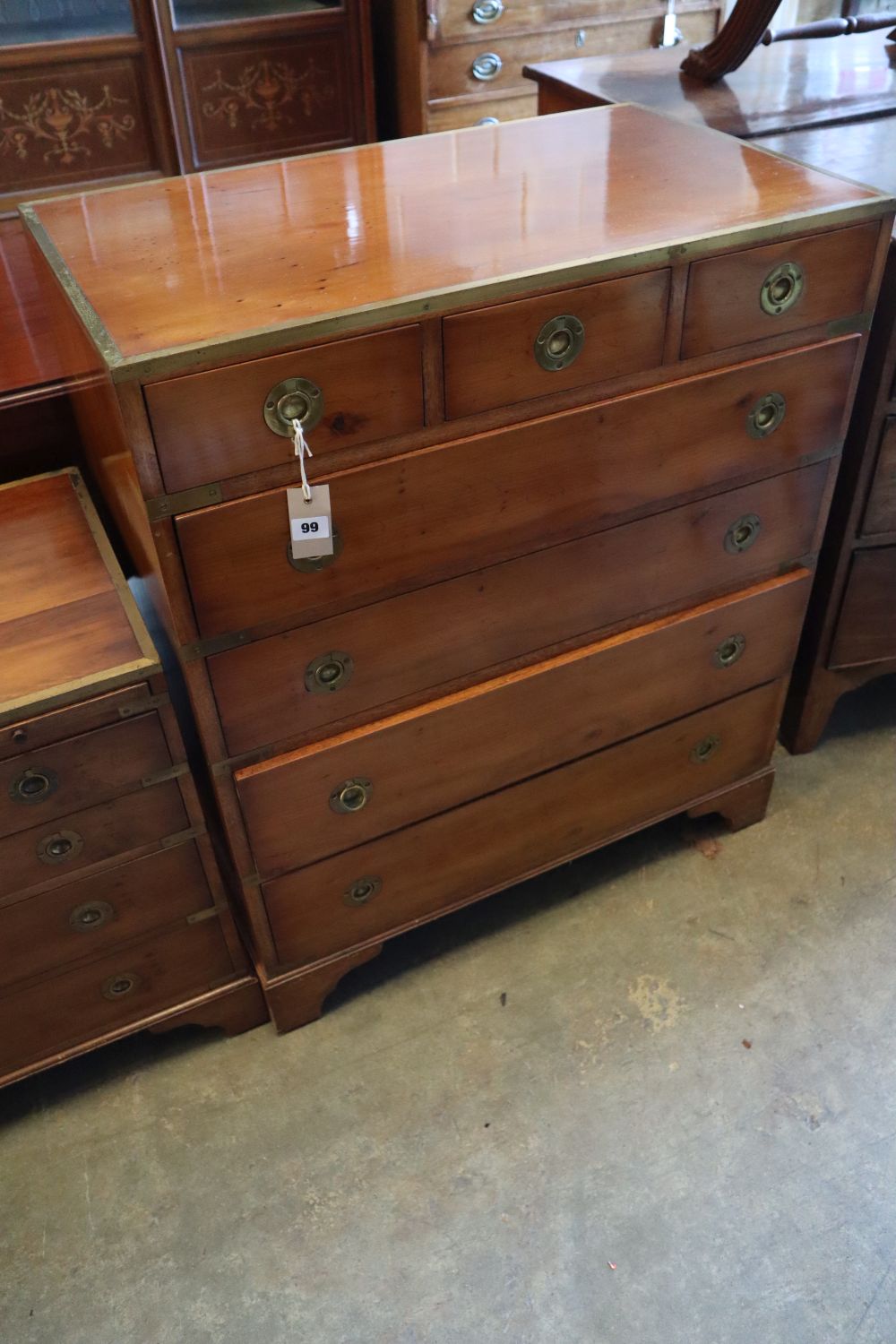 A brass mounted yew wood campaign style chest of three short and four graduated long drawers, width 77cm height 90cm and another simila